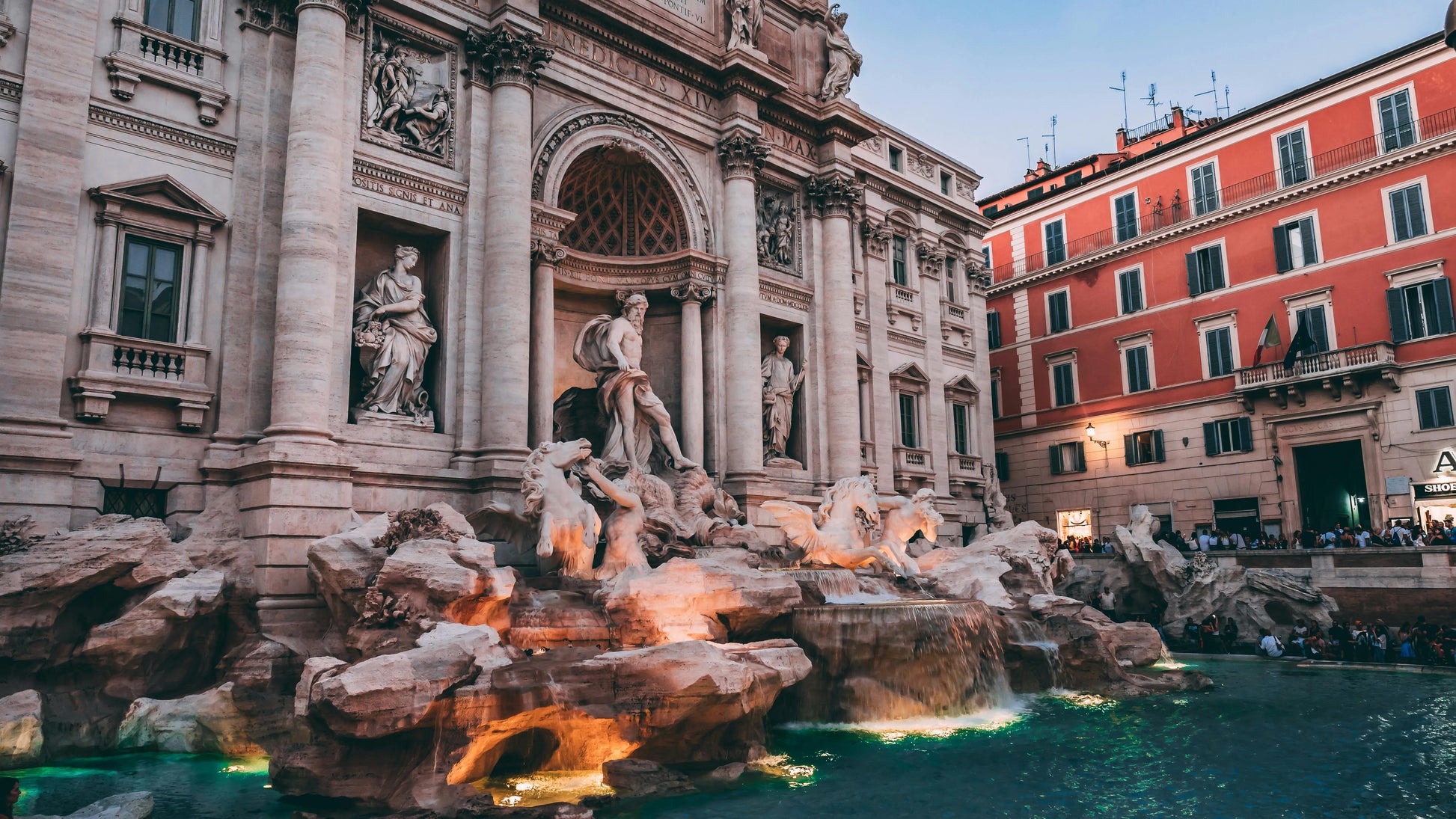 Famous fountain with classical statues in an urban setting