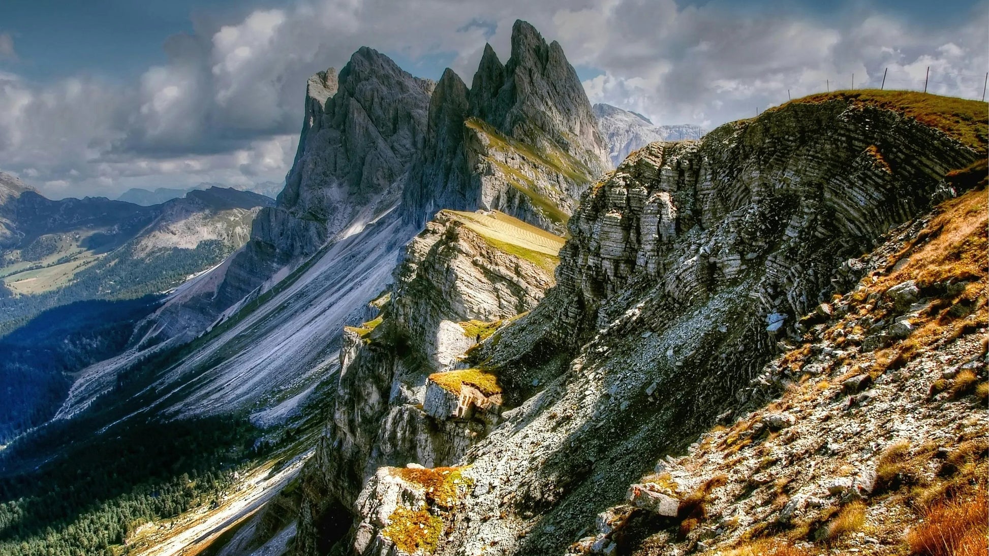 Mountain landscape with rocky peaks and a cloudy sky