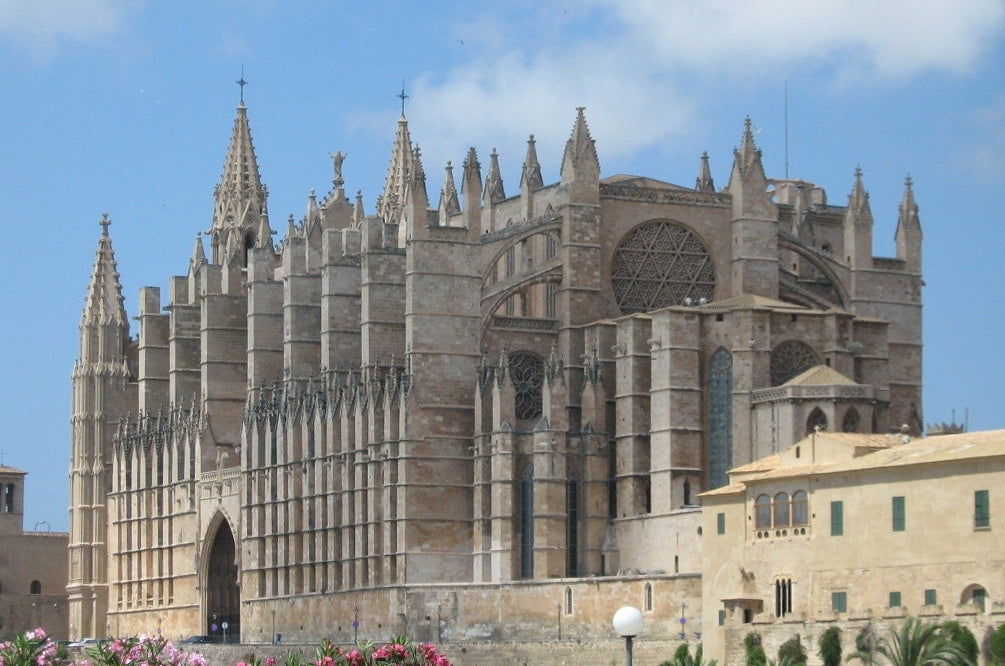 Gothic cathedral with intricate architecture under a clear blue sky