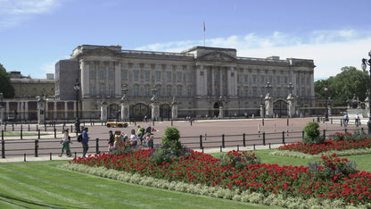 Buckingham Palace with a flower bed in the foreground