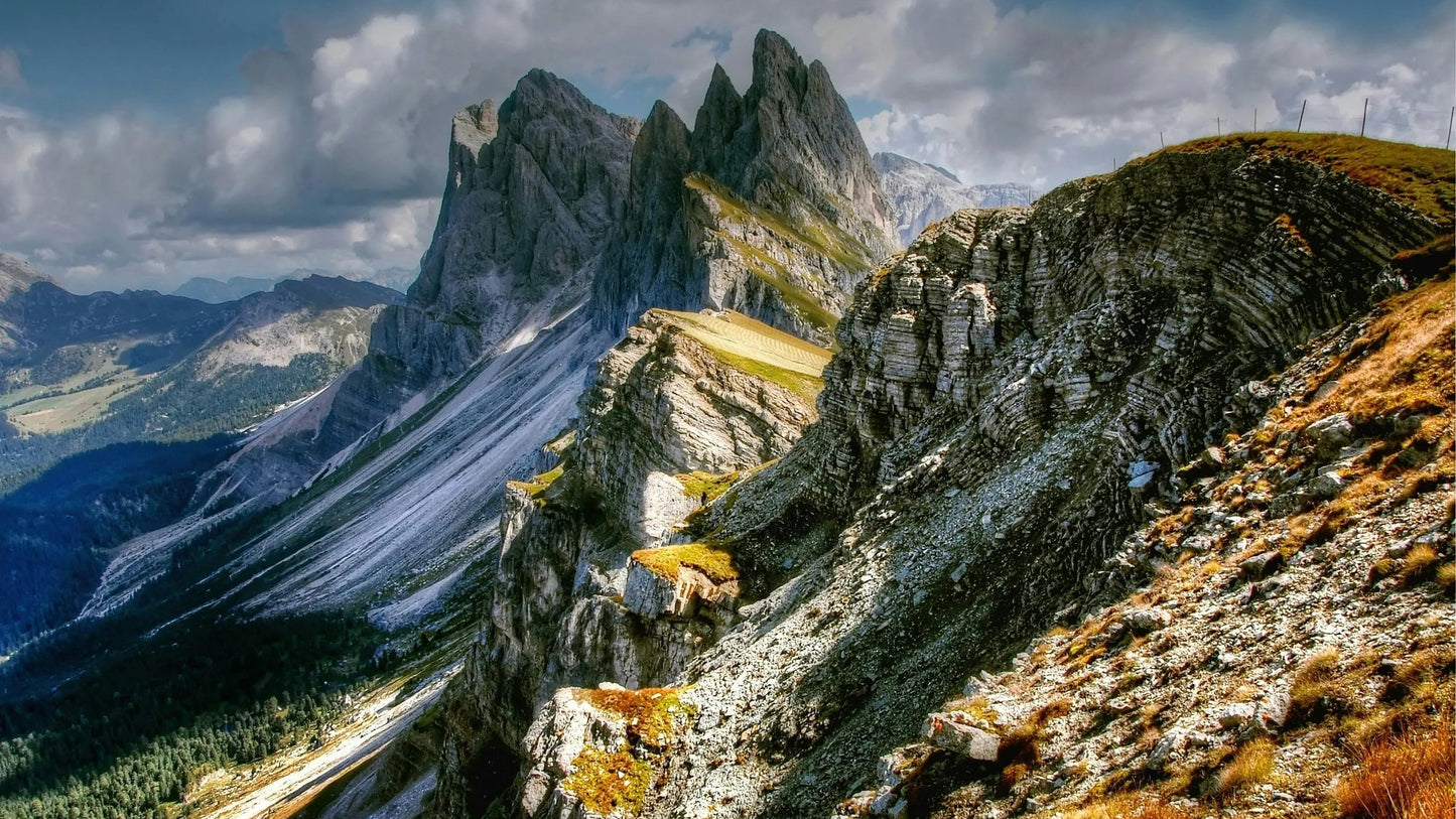 Mountain landscape with rocky peaks and a cloudy sky