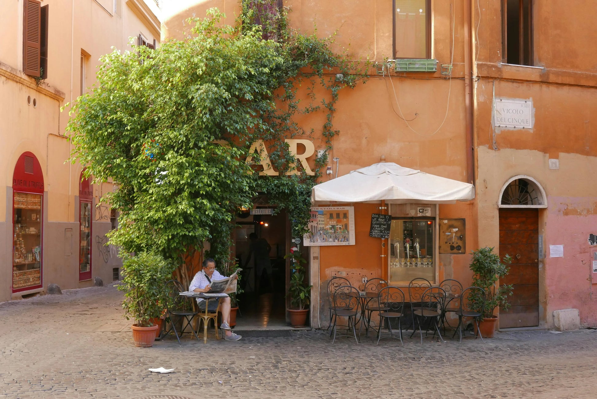 Outdoor seating area in front of a building with 'Ristorante' sign
